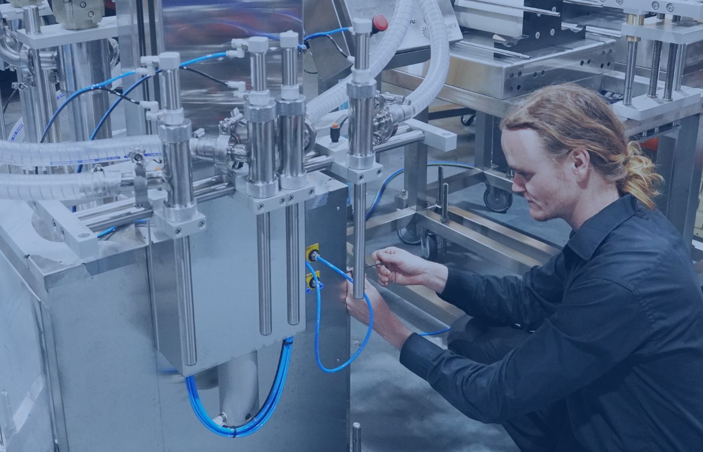 Blog cover image: A well-maintained filling machine in a factory setting, highlighting maintenance best practices.