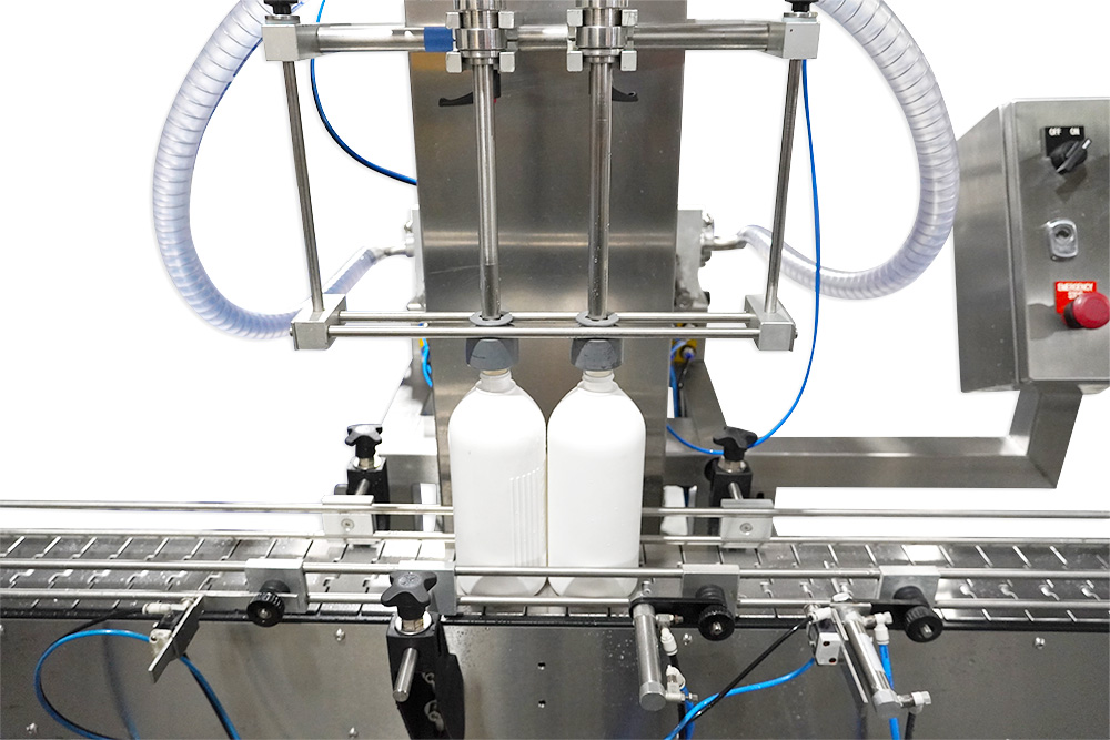 Bell Locating Assembly accessory installed on a Packserv liquid filling machine for precise container alignment